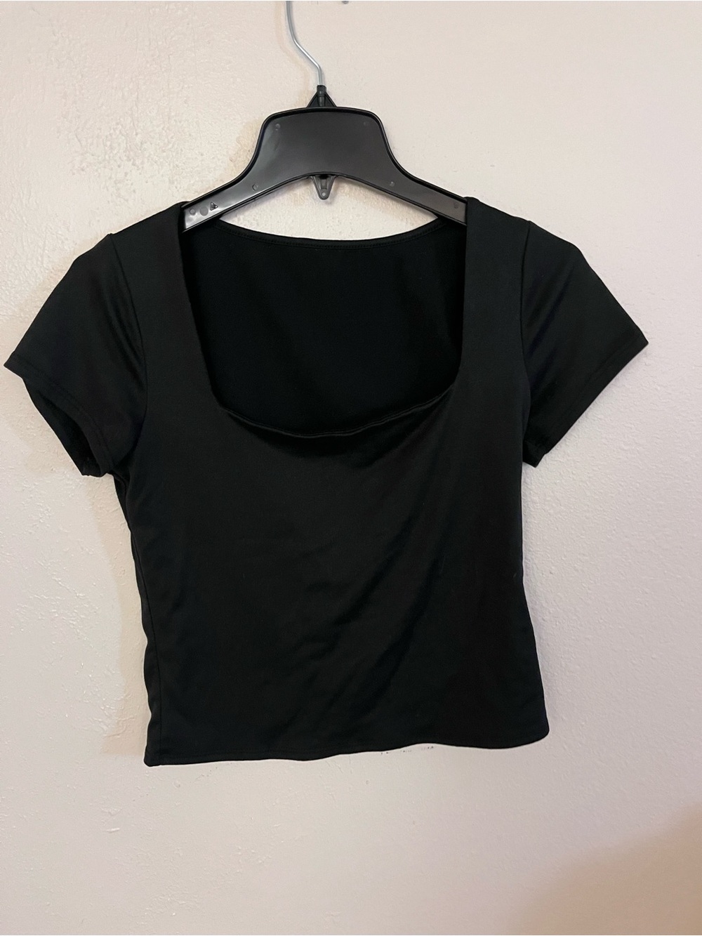 Women black top is a fitted distinct square neckline size medium
